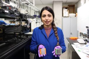 HTMDEC_IMG_0302 Arezoo Zare (postdoc) holding a metallic alloy sample after a laser shock experiment for HTMDEC.