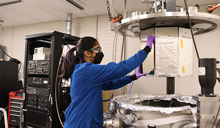 Rayna Mehta (PhD candidate) creating thin foil metallic samples in the DC magnetron physical vapor deposition chamber.