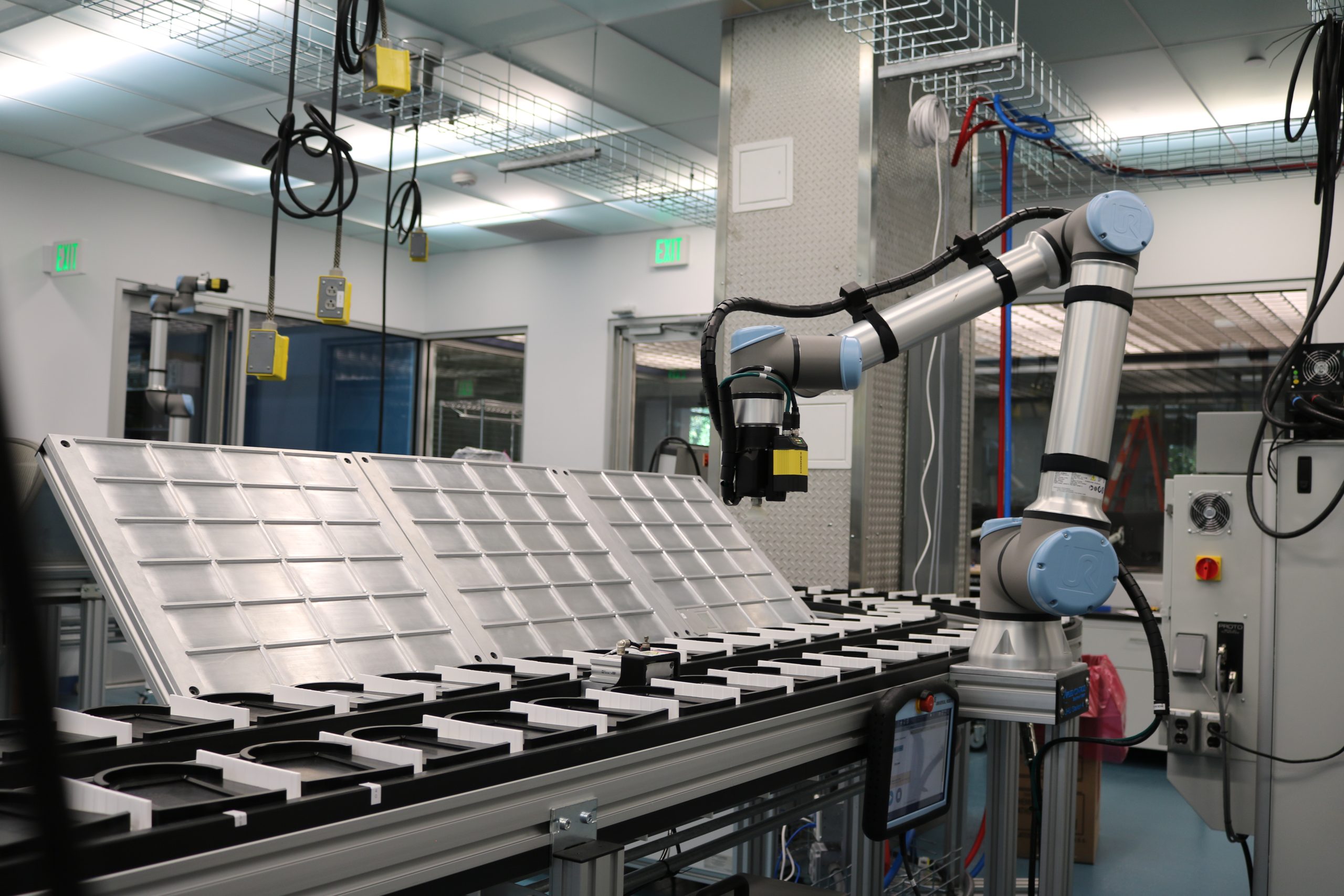 UR10e robot next to conveyance system