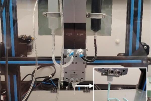 A 3D printer extruding filament