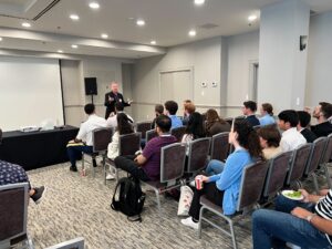 Randy Manner addressing a group of students