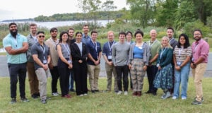 Group of individuals posing for photo