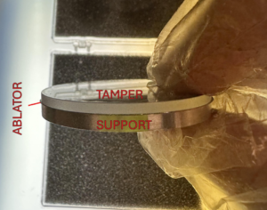 A labeled sample showing the tamper, ablator, and support used for this experiment.