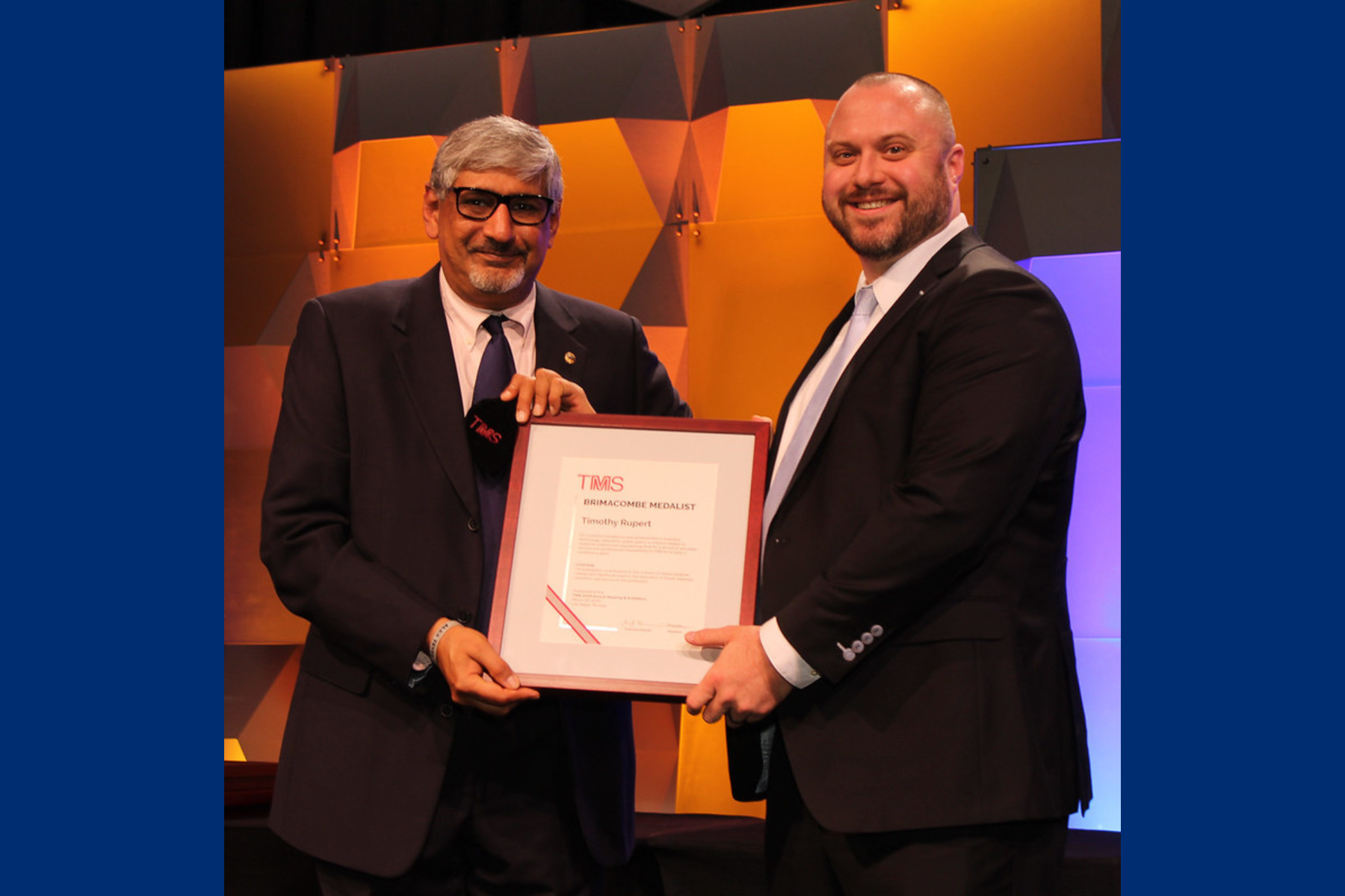 Tim Rupert accepts the Brimacombe Medal