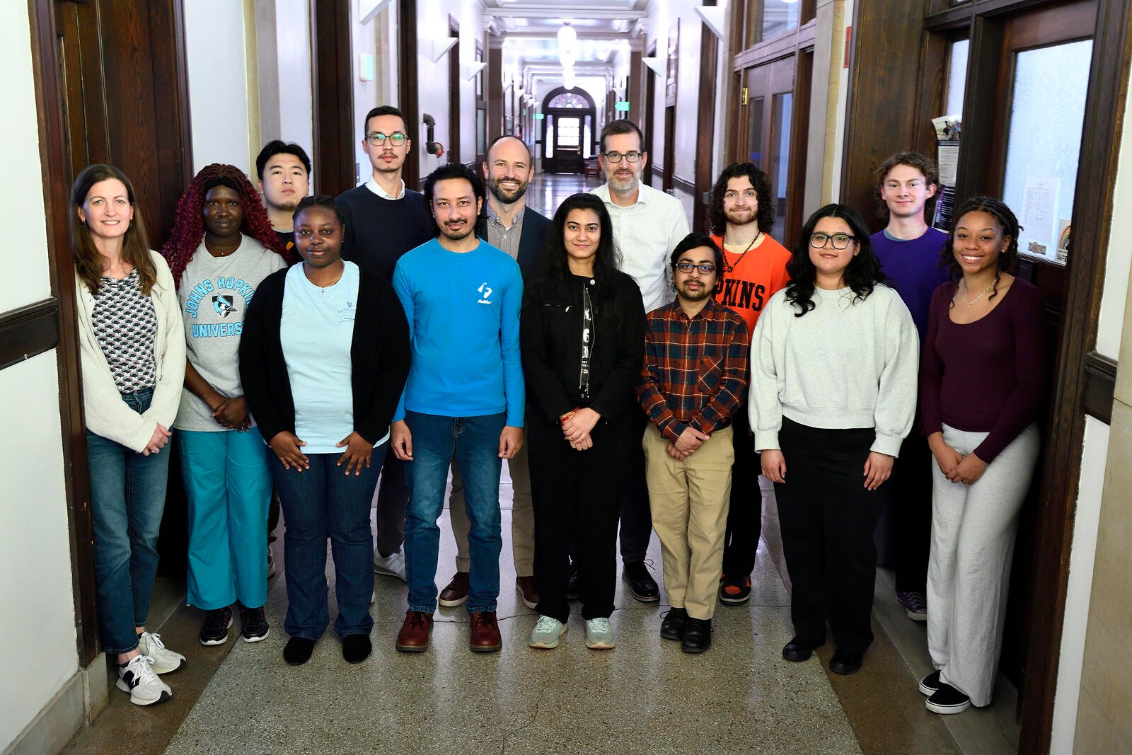 Michael Shields, center, poses with students and researchers on his research team.